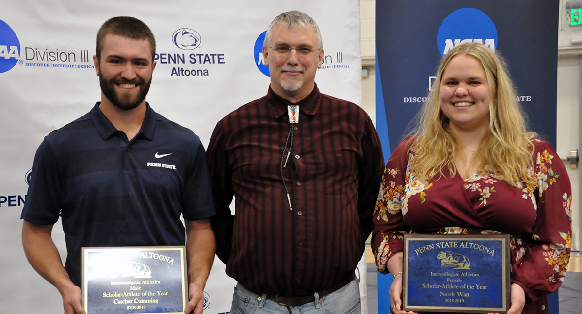 Photo (L-R): Junior Catcher Cumming, Faculty Athletics Representative Dr. Victor Brunsden, and senior Nicole Watt pose with the Scholar-Athlete of the Year awards.
