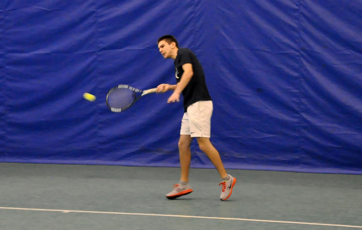 Photo: Freshman Kirk Eichenlaub hits a forehand shot during his No. 6 singles match against W&J on Saturday.