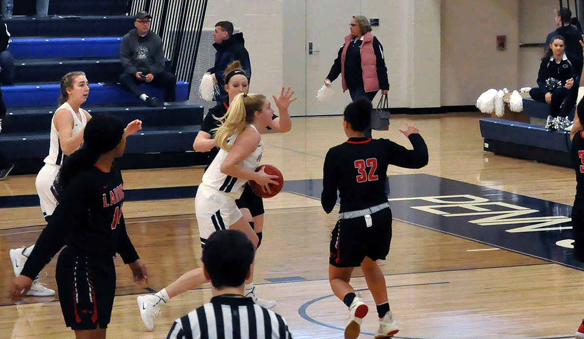 Photo (by Kerry Maines): Sophomore guard/forward Alexis Cannistraci drives through the paint during Saturday's loss to La Roche in the Adler Arena.