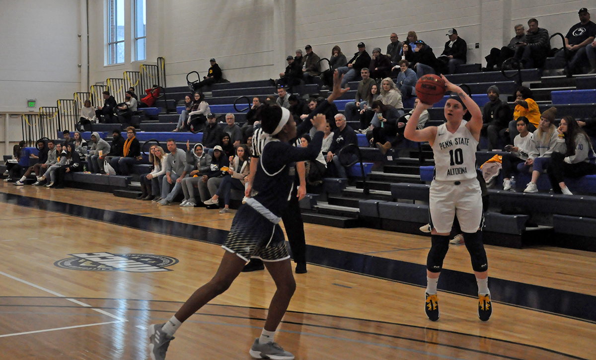 Photo (by Oliver Dailey): Junior guard Sydney Snyder pulls up for a three-pointer during Saturday's victory over Pitt-Bradford.
